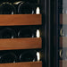  Swiss Cave Premium Edition Close up of Sapele wood pull out shelves with white lighting.