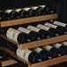 Swiss Cave Premium Edition two pulled out shelves stocked with bordeaux bottles.